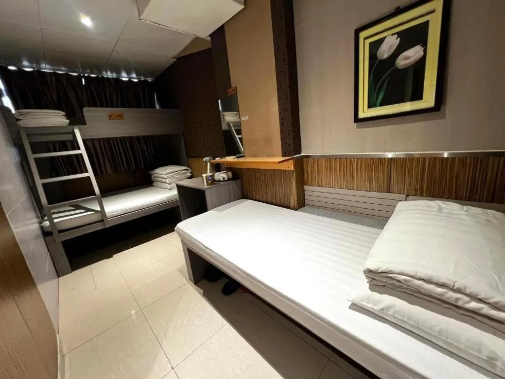 Bed in New Mong Kok Guest House