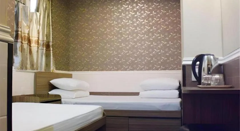 Bed in New Mong Kok Guest House