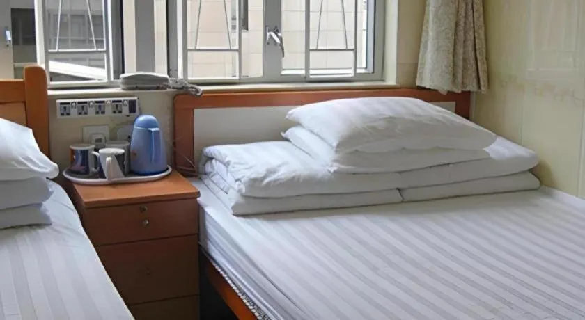Bed in New Mong Kok Guest House