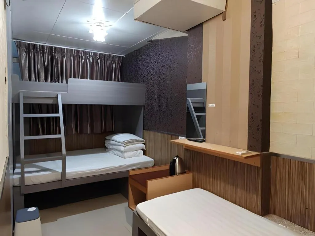 Bed in New Mong Kok Guest House