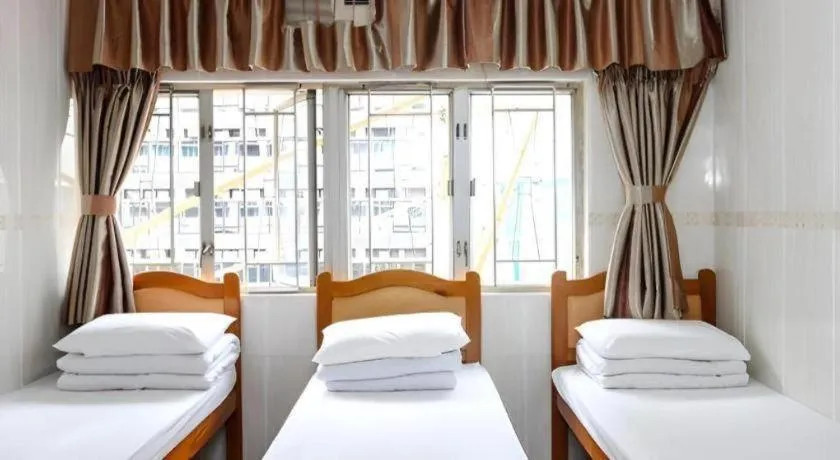 Bed in New Mong Kok Guest House