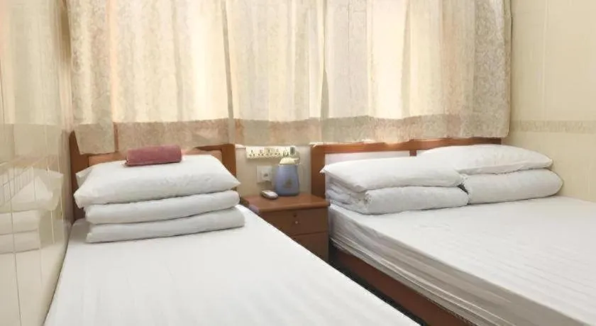 Bed in New Mong Kok Guest House