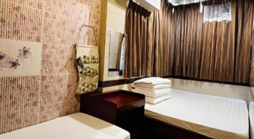 Bed in New Mong Kok Guest House