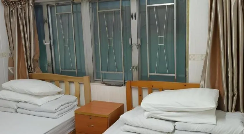 Bed in New Mong Kok Guest House