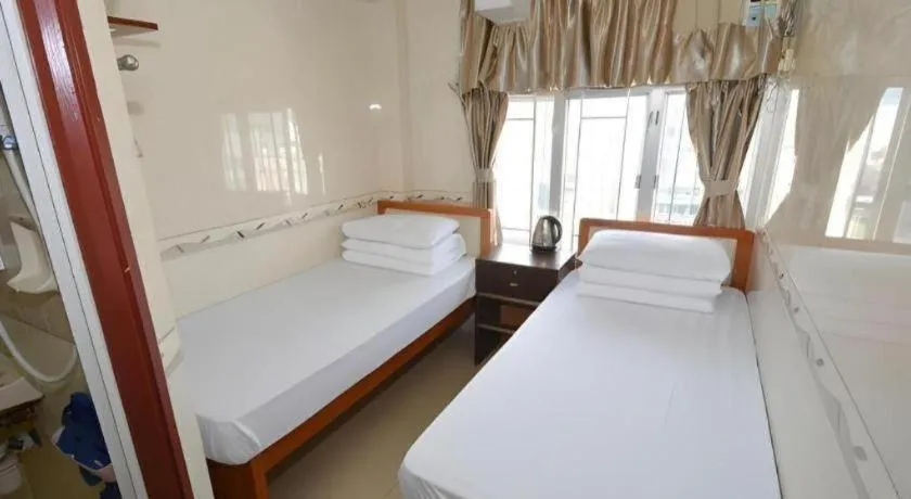 Bed in New Mong Kok Guest House