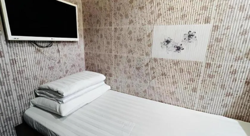 Bed in New Mong Kok Guest House