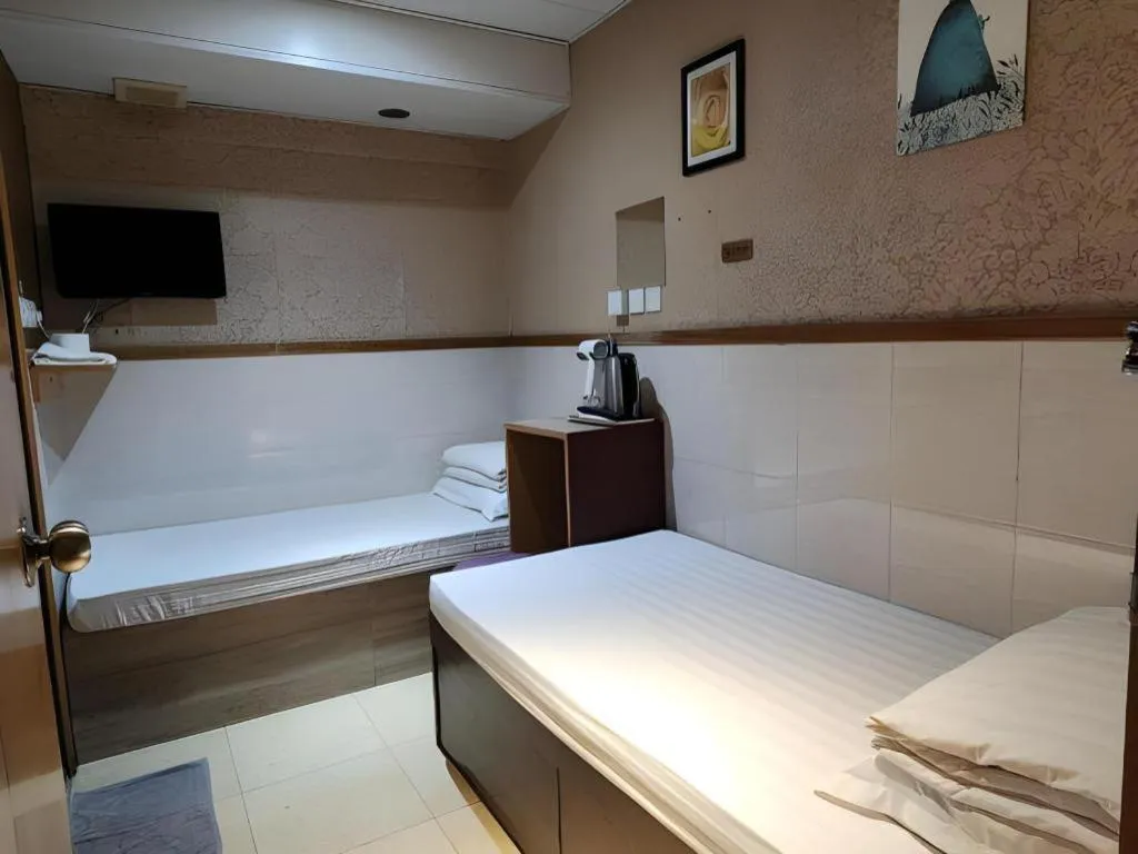 Bed in New Mong Kok Guest House