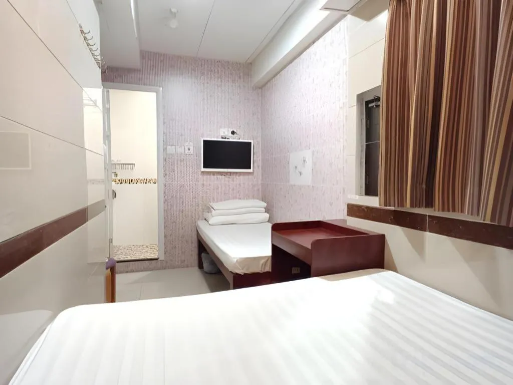 Bed in New Mong Kok Guest House