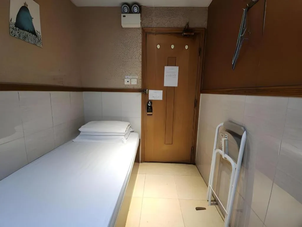 Bed in New Mong Kok Guest House