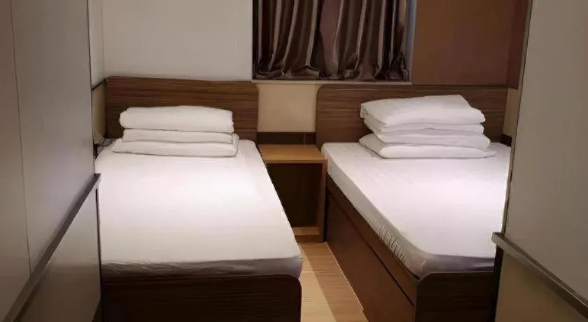 Bed in New Mong Kok Guest House