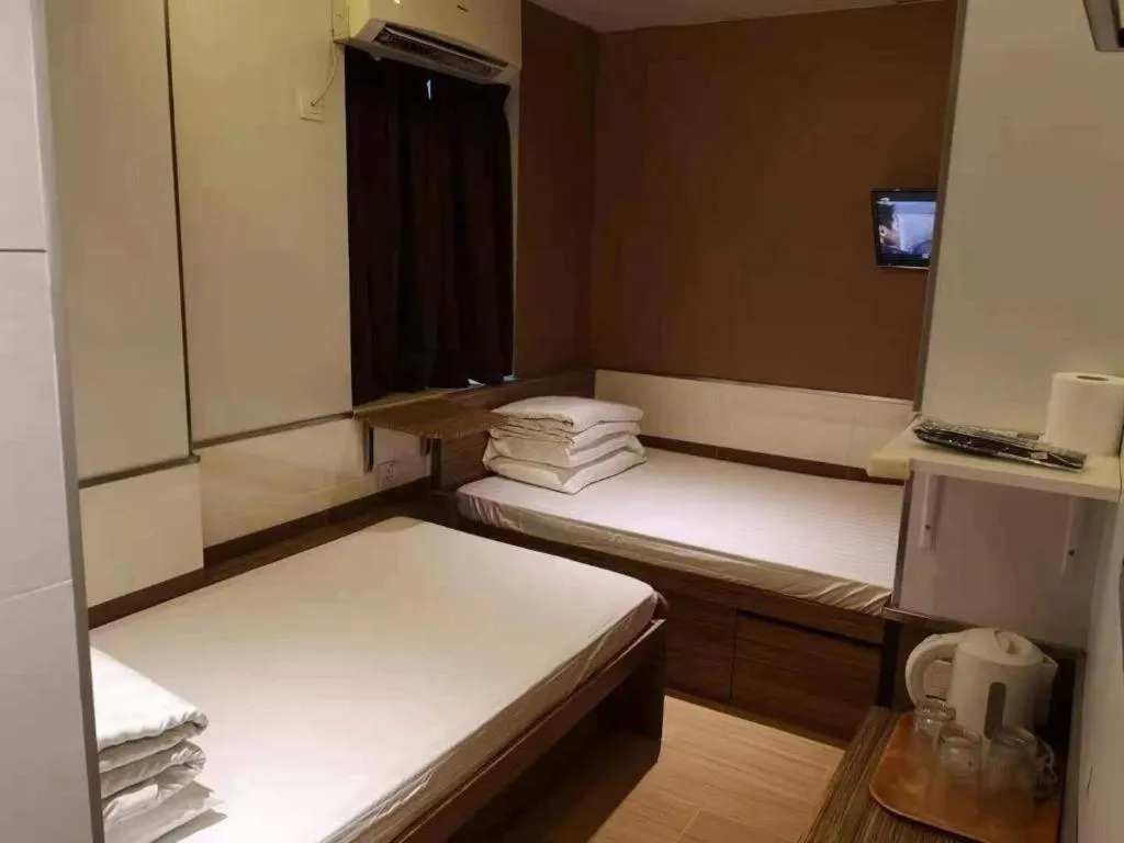 Bed in New Mong Kok Guest House