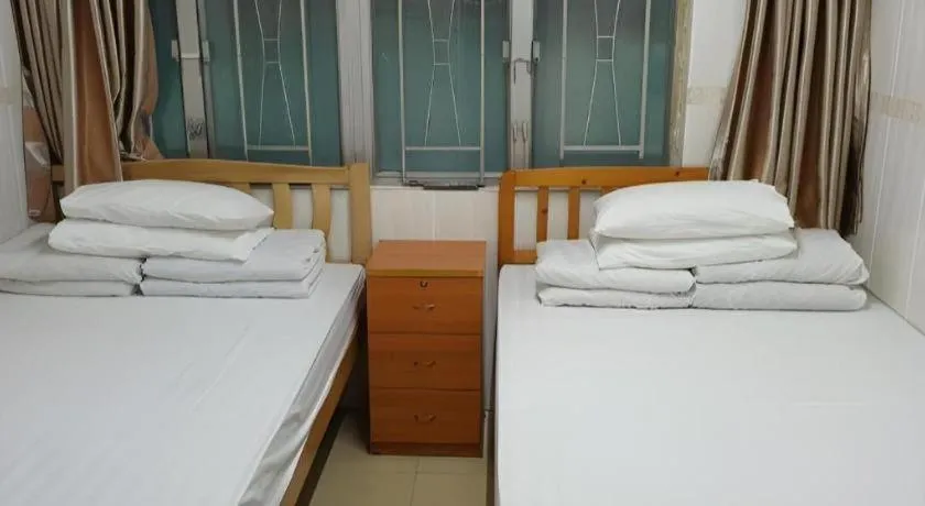 Bed in New Mong Kok Guest House