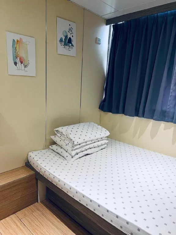 Bed in New Mong Kok Guest House