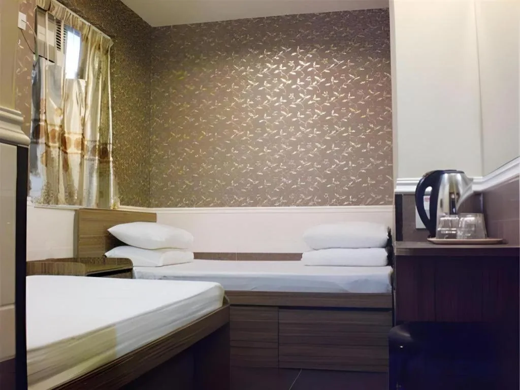 Bed in New Mong Kok Guest House