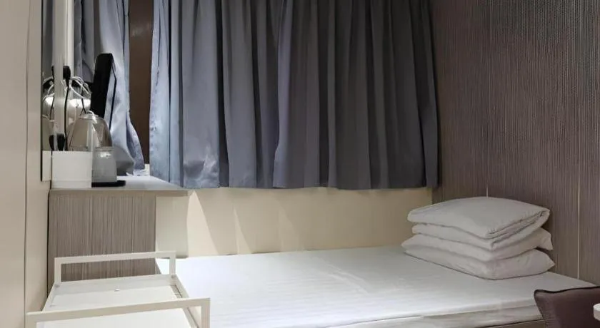 Bed in New Mong Kok Guest House