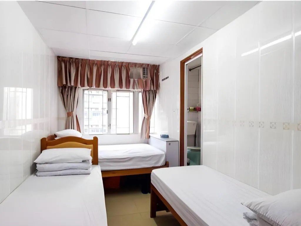 Bed in New Mong Kok Guest House