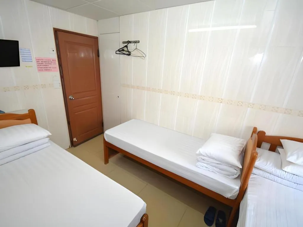 Bed in New Mong Kok Guest House