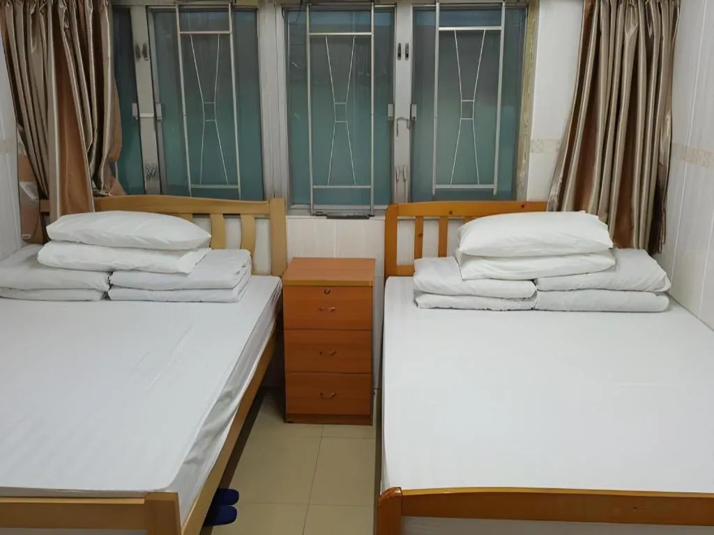 Bed in New Mong Kok Guest House