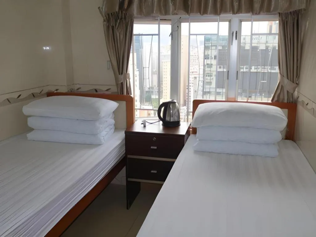 Bed in New Mong Kok Guest House