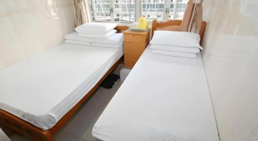 Bed in New Mong Kok Guest House