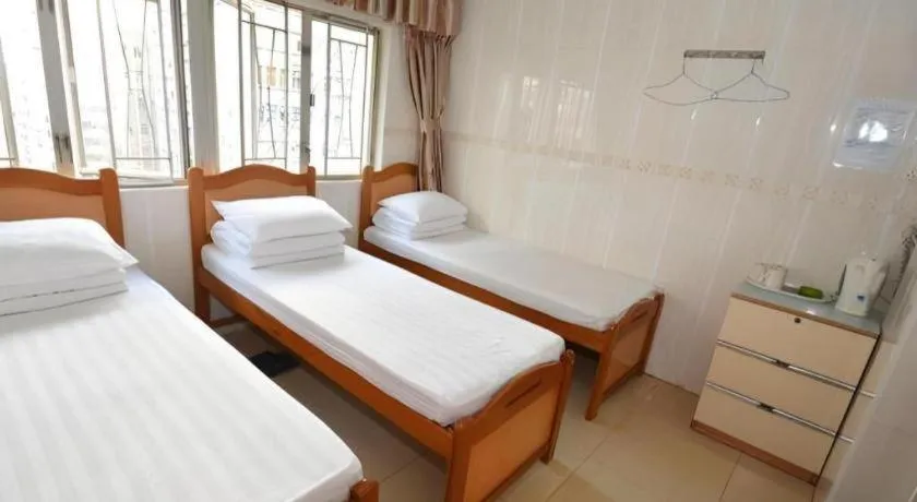 Bed in New Mong Kok Guest House