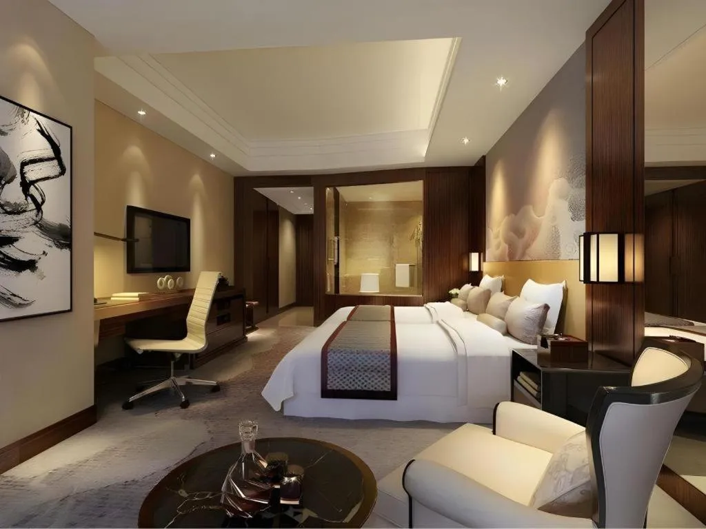 Bed in New Century Grand Hotel Hangzhou Fuyang Dongfangmao
