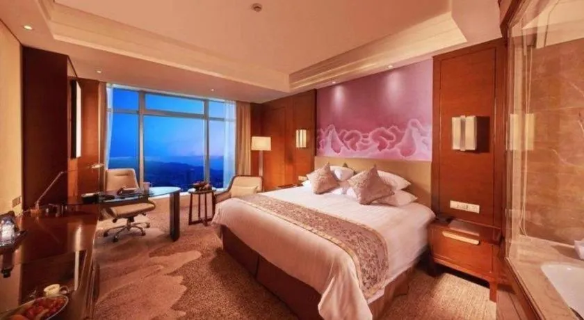 Bed in New Century Grand Hotel Hangzhou Fuyang Dongfangmao
