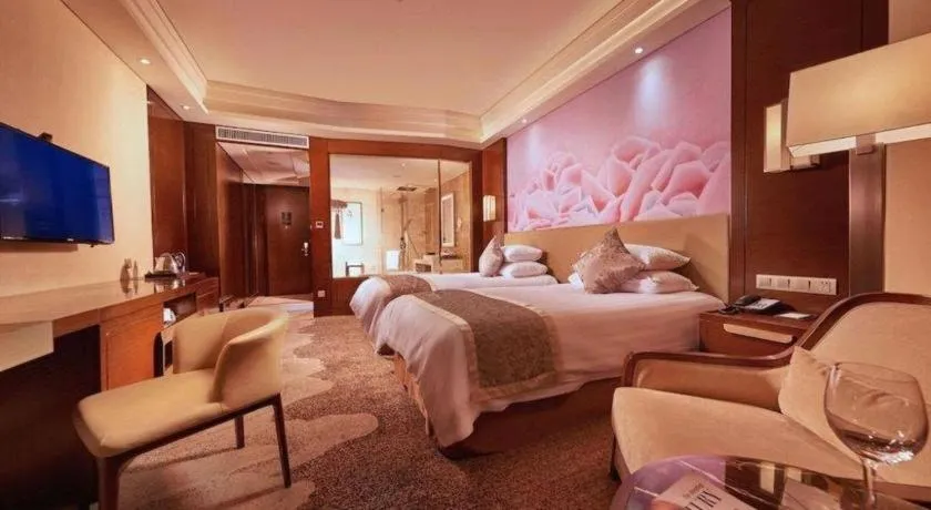 Bed in New Century Grand Hotel Hangzhou Fuyang Dongfangmao
