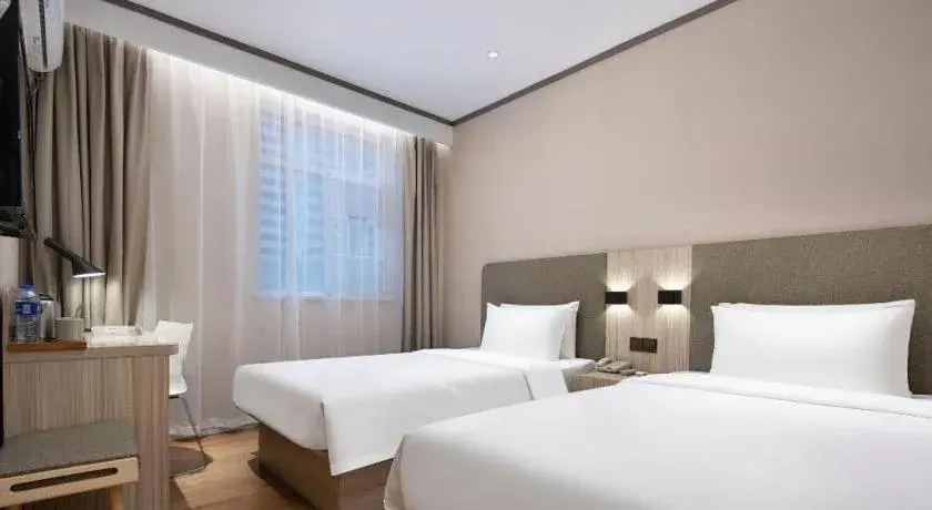 Bed in Hanting Hotel Changsha Xiangya Fu'er Ziyuan Road Bed in Hanting Hotel Changsha Xiangya Fu'er Ziyuan Road