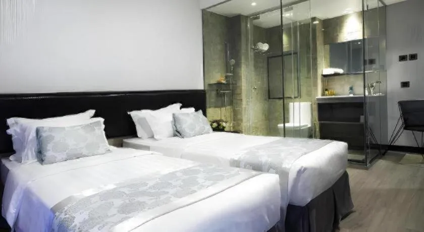 Bed in M1 North Point Hotel