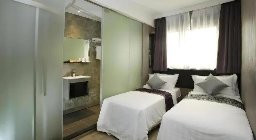 Bed in M1 North Point Hotel