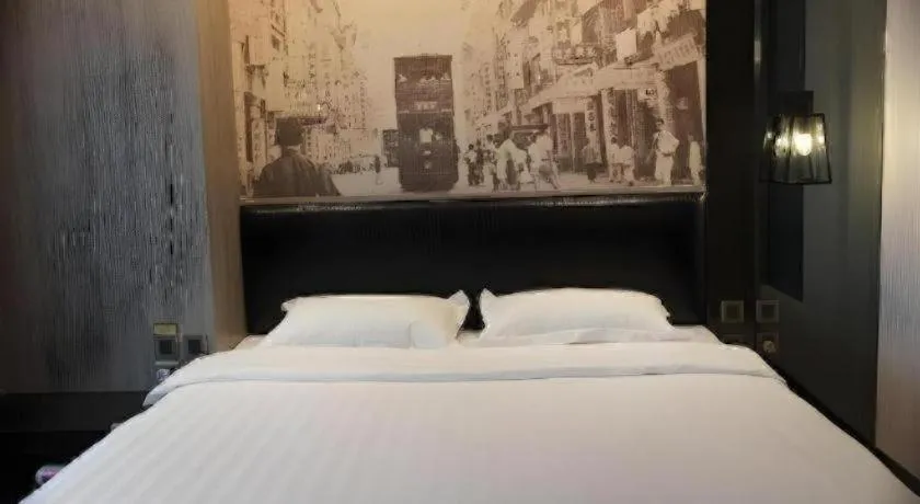 Bed in M1 North Point Hotel