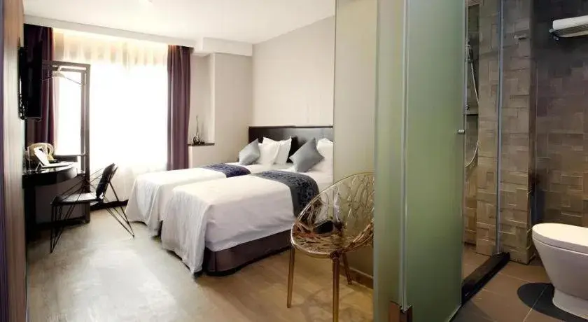 Bed in M1 North Point Hotel Bed in M1 North Point Hotel