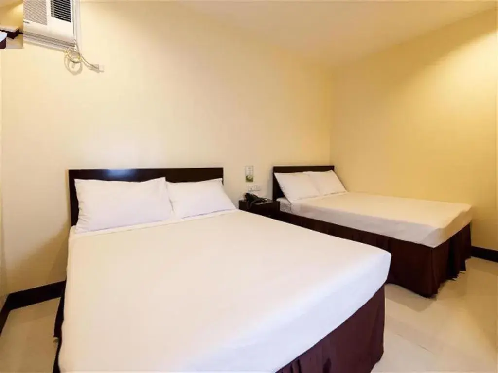 Bed in Winzelle Suites Bed in Winzelle Suites