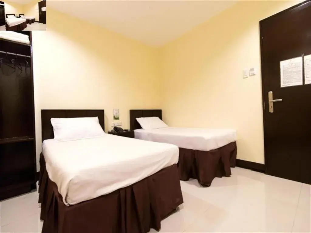 Bed in Winzelle Suites Bed in Winzelle Suites