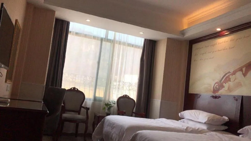 Bed in Vienna Classic Hotel Ningbo Xiangshan Wanda