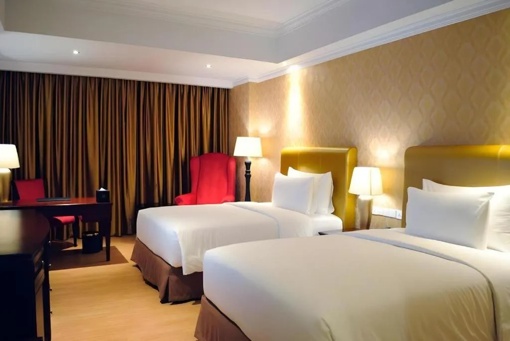 Bed in Adimulia Hotel Medan