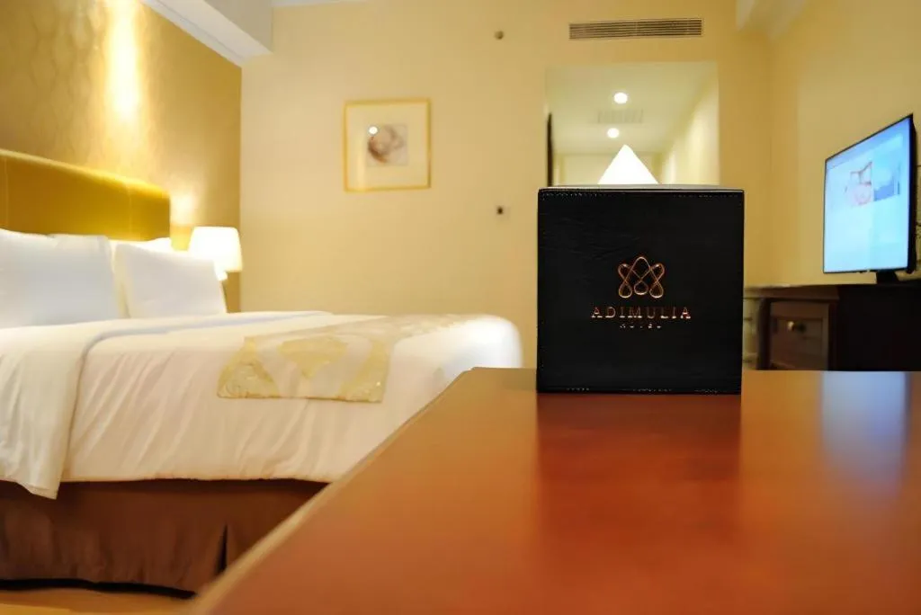 Bed in Adimulia Hotel Medan