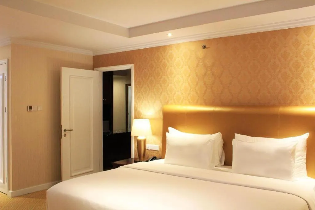 Bed in Adimulia Hotel Medan