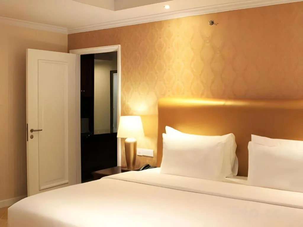 Bed in Adimulia Hotel Medan