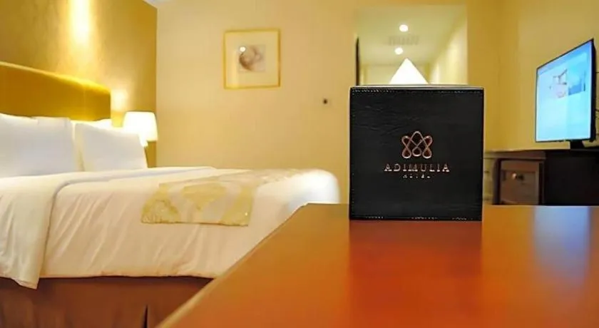 Bed in Adimulia Hotel Medan