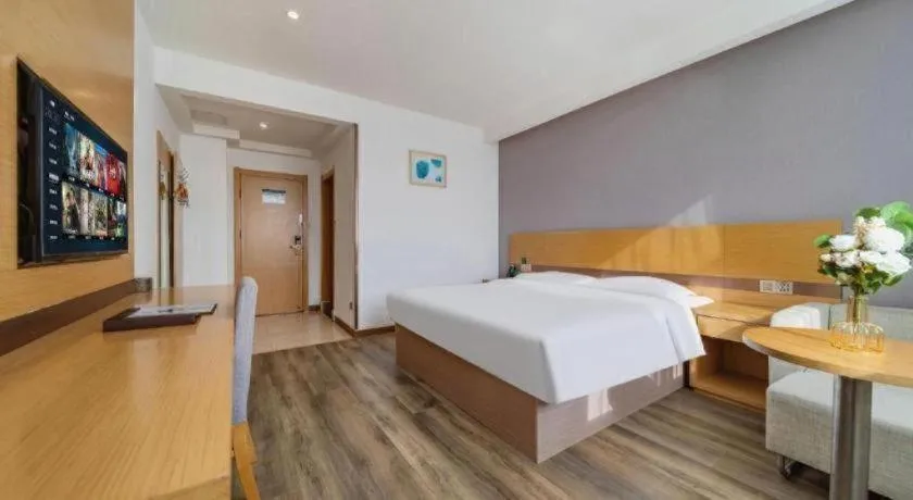 Bed in GreenTree Inn Nantong Zhangzhishan Town Deli Plaza Express Hotel