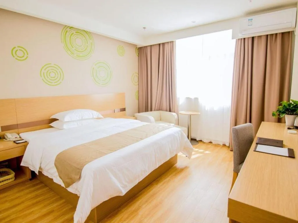 Bed in GreenTree Inn Nantong Zhangzhishan Town Deli Plaza Express Hotel