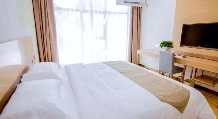 Bed in GreenTree Inn Nantong Zhangzhishan Town Deli Plaza Express Hotel