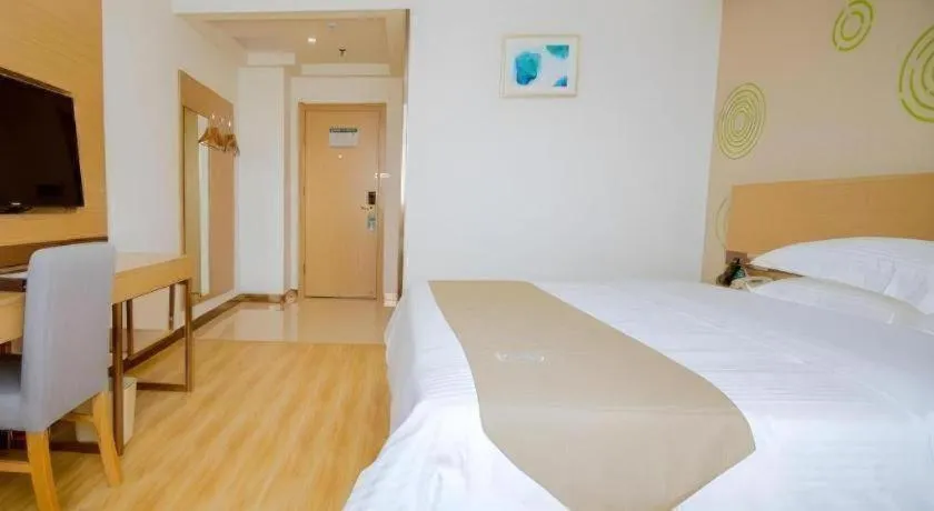 Bed in GreenTree Inn Nantong Zhangzhishan Town Deli Plaza Express Hotel