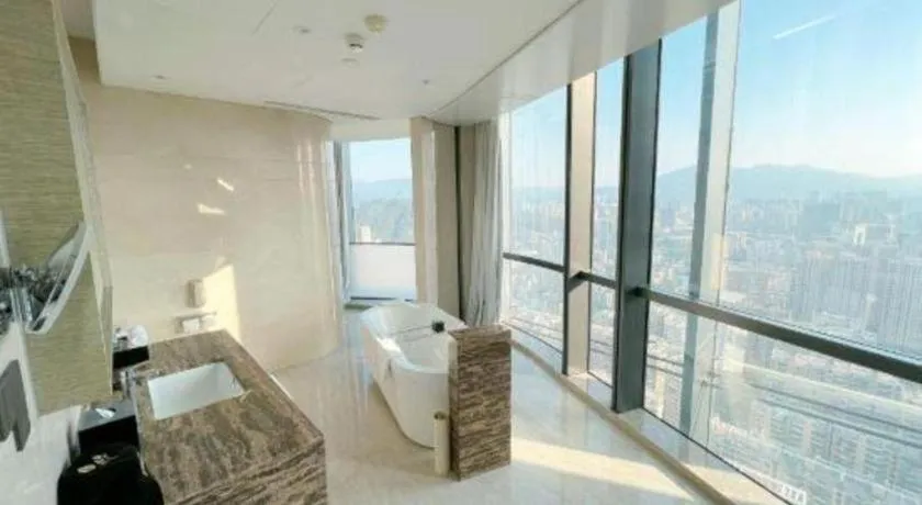 Bed in LONGYAN JINGHUA FLIPORT HOTEL