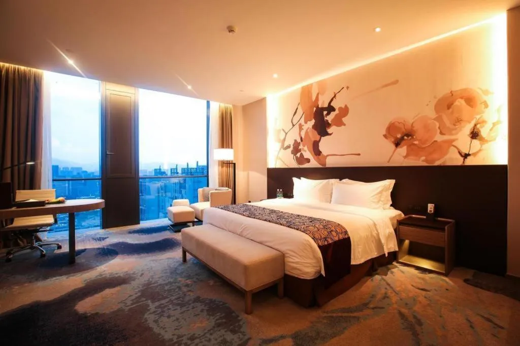 Bed in LONGYAN JINGHUA FLIPORT HOTEL