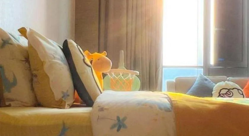 Bed in LONGYAN JINGHUA FLIPORT HOTEL