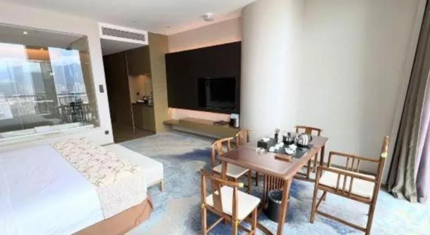 Bed in LONGYAN JINGHUA FLIPORT HOTEL