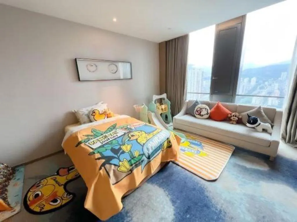 Bed in LONGYAN JINGHUA FLIPORT HOTEL